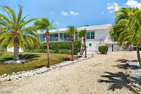 Photo of 5866 Tahiti Drive, Bokeelia, FL 33922 (MLS # 2026018149)