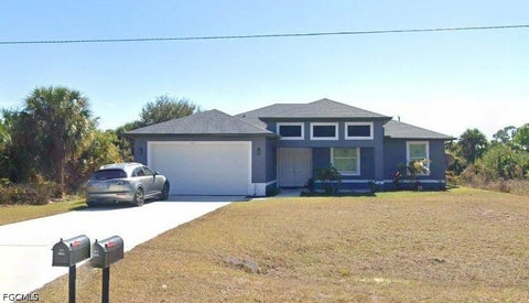 Photo of 1244 Jaguar Boulevard, Lehigh Acres, FL 33974 (MLS # 2026042406)
