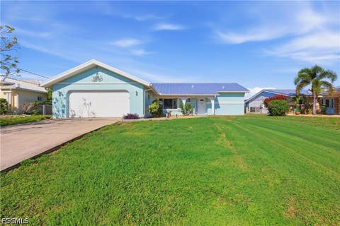 Photo of 414 Spring Lake Boulevard NW, Port Charlotte, FL 33952 (MLS # 2026017487)