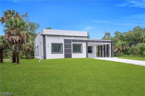 Photo of 3304 E 15th Street, Lehigh Acres, FL 33972 (MLS # 2026036735)