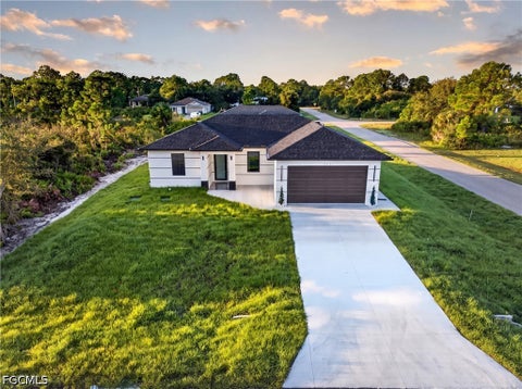 Photo of 2621 40th Street W, Lehigh Acres, FL 33971 (MLS # 2026041080)