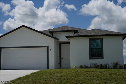 Photo of 605 Greenbriar Boulevard, Lehigh Acres, FL 33972 (MLS # 2026039132)