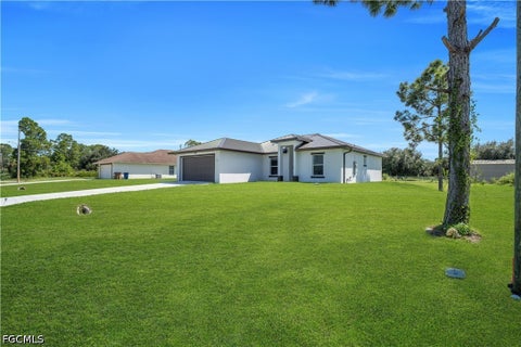 Photo of 13 W 9th Street, Lehigh Acres, FL 33972 (MLS # 2026043082)