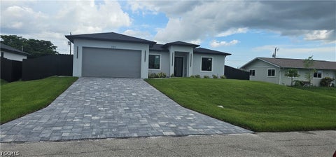 Photo of 1122 NW 15 Street, Cape Coral, FL 33993 (MLS # 2026039540)
