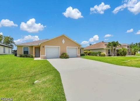 Photo of 702 SE 6th Terrace, Cape Coral, FL 33990 (MLS # 2026026771)