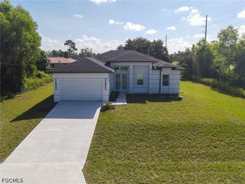 Photo of 100 Denis Avenue N, Lehigh Acres, FL 33971 (MLS # 2026039468)