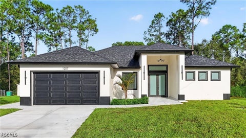 Photo of 1207 Ramus Street E, Lehigh Acres, FL 33974 (MLS # 2026042669)