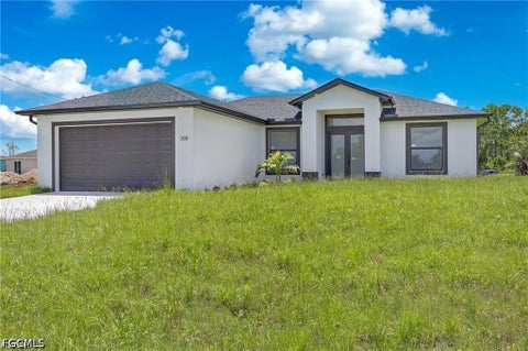 Photo of 208 PEMBROKE Street, Lehigh Acres, FL 33974 (MLS # 2026031113)