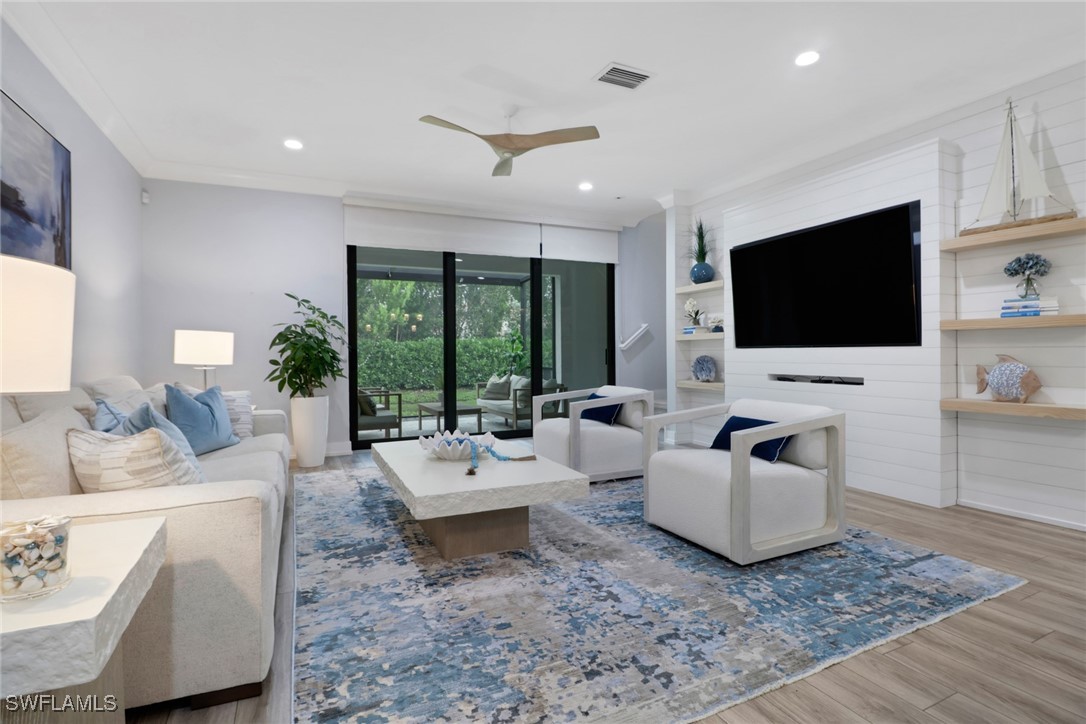 Living room featuring wood finished floors, recess
