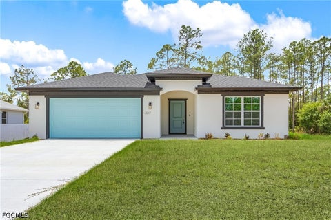 Photo of 337 Woodburn Drive, Lehigh Acres, FL 33972 (MLS # 2026037339)