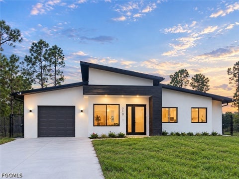 Photo of 712 Bumby Street E, Lehigh Acres, FL 33974 (MLS # 2026040461)
