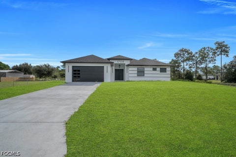 Photo of 1704 Clayton Avenue, Lehigh Acres, FL 33972 (MLS # 2026042733)