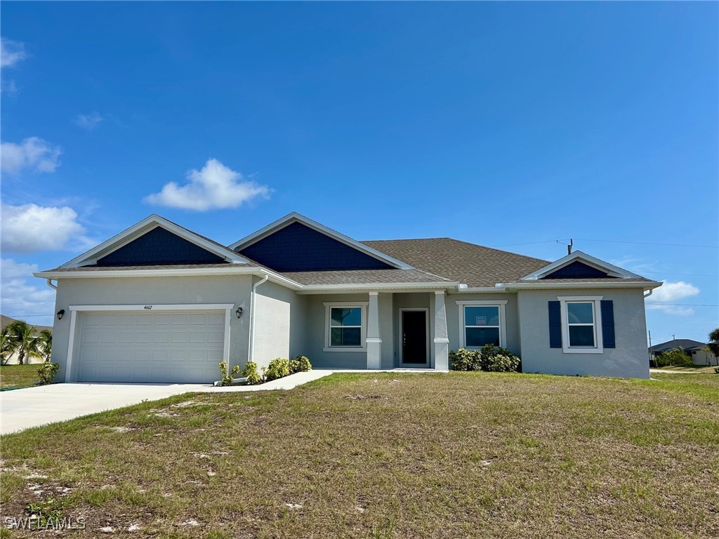 Ranch-style house featuring stucco siding, a front