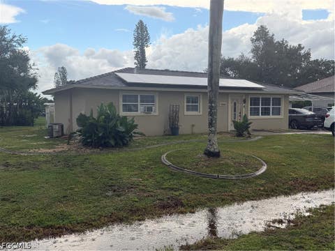 Photo of 1398 Sunrise Drive, North Fort Myers, FL 33917 (MLS # 2026033743)