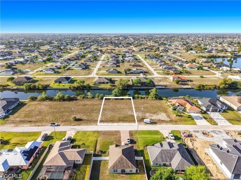 Photo of 1122 NW 18th Terrace, Cape Coral, FL 33993 (MLS # 2026039439)