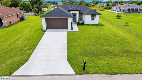 Photo of 760 Goodrich Avenue S, Lehigh Acres, FL 33974 (MLS # 2026040479)