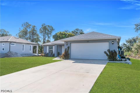 Photo of 2617 53rd Street W, Lehigh Acres, FL 33971 (MLS # 2026035477)