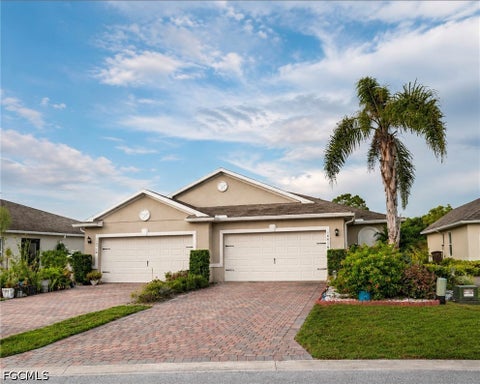 Photo of 10716 Crossback Lane, Lehigh Acres, FL 33936 (MLS # 2026036956)