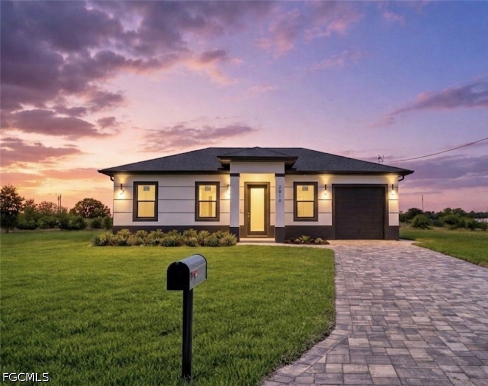 Single-story residence featuring a dark roof, ligh