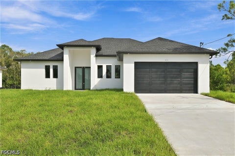 Photo of 631 Foxchase Drive, Lehigh Acres, FL 33974 (MLS # 2026042062)