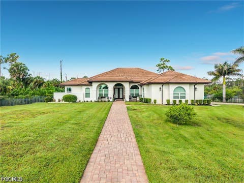 Photo of 90 22nd Avenue NW, Naples, FL 34120 (MLS # 2026034810)