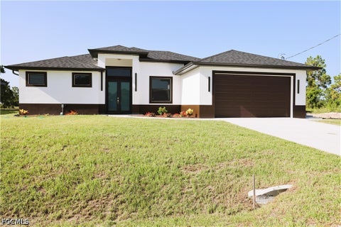 Photo of 1216 Delores Street E, Lehigh Acres, FL 33974 (MLS # 2026037427)