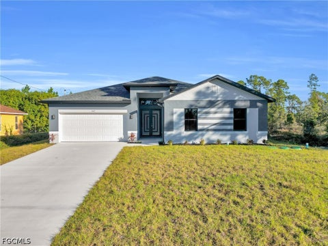 Photo of 1235 Claremont Street E, Lehigh Acres, FL 33974 (MLS # 2026039722)