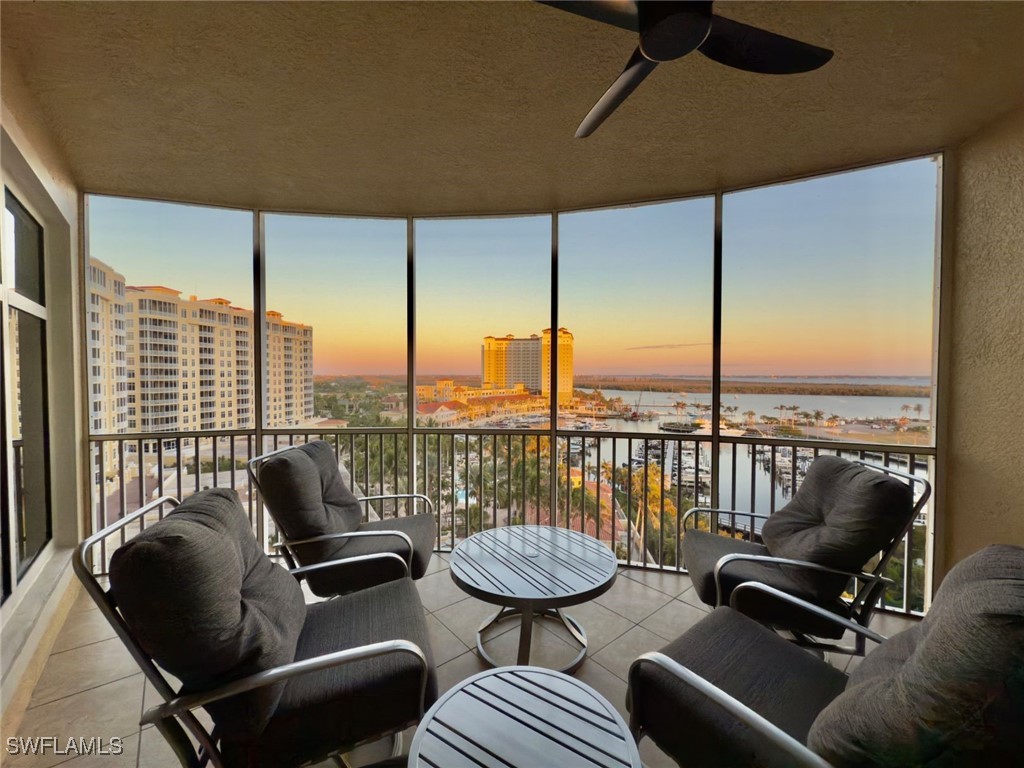 Screened Lanai with ceiling fan and a marina water
