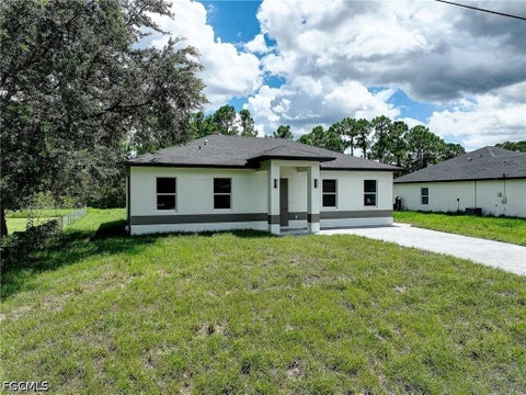 Photo of 940 Lakeside Drive, Lehigh Acres, FL 33974 (MLS # 2026038788)