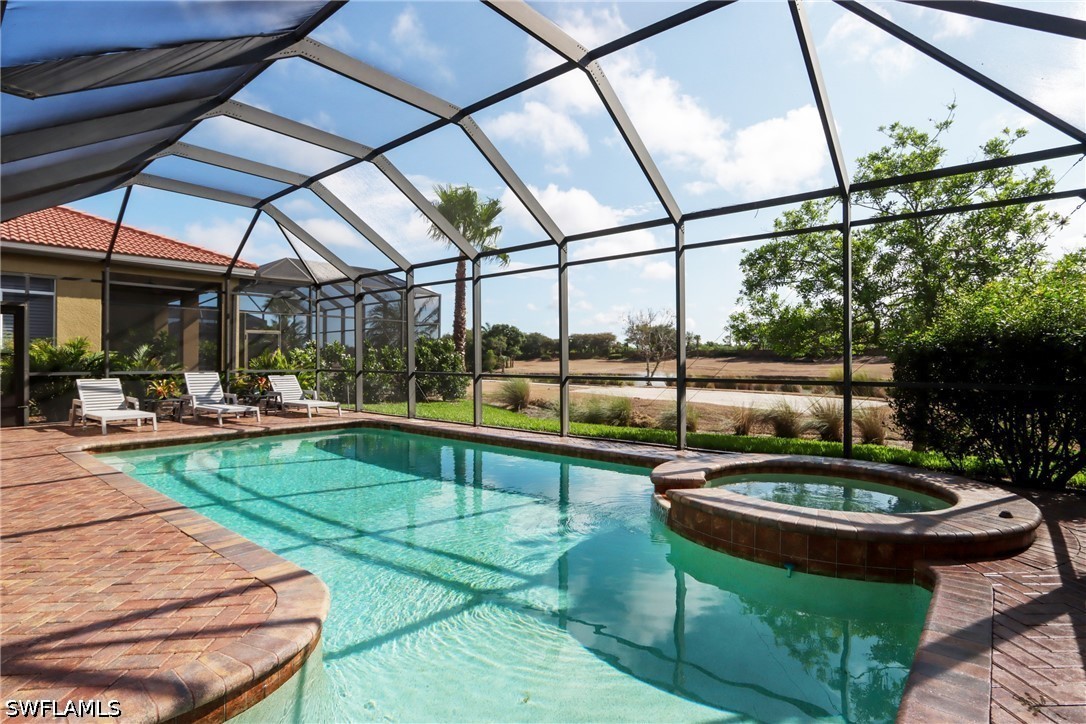 View of swimming pool featuring a patio, a pool wi