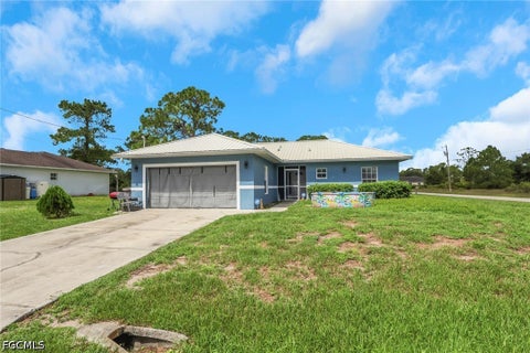 Photo of 912 Mary Avenue S, Lehigh Acres, FL 33974 (MLS # 2026037099)