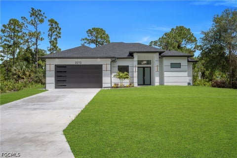 Photo of 3212 33rd Street W, Lehigh Acres, FL 33971 (MLS # 2026037208)