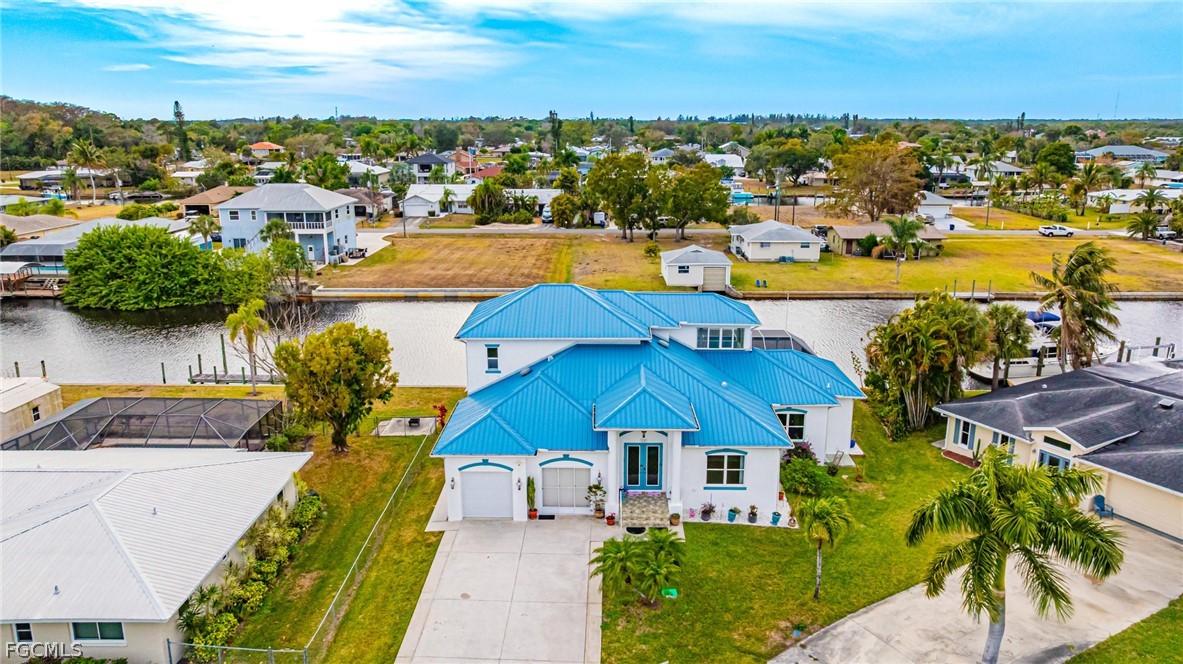 Aerial view of residential area with a nearby body