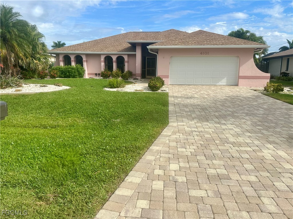 View of front of home featuring stucco siding, dec