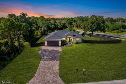 Photo of 810 Sentinela Boulevard, Lehigh Acres, FL 33974 (MLS # 2026037413)