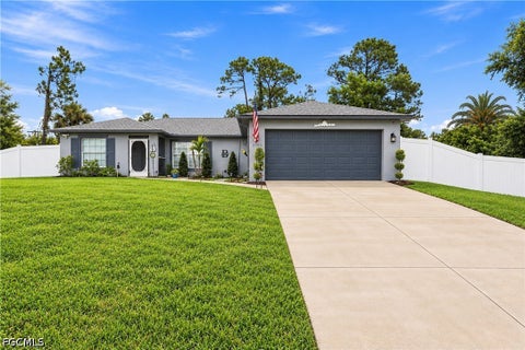 Photo of 2703 E 8th Street, Lehigh Acres, FL 33936 (MLS # 2026038053)
