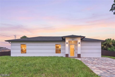 Photo of 707 Sawyer Street, Lehigh Acres, FL 33974 (MLS # 2026038586)