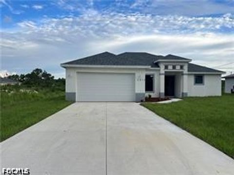 Photo of 2813 23rd Street W, Lehigh Acres, FL 33971 (MLS # 2026020159)