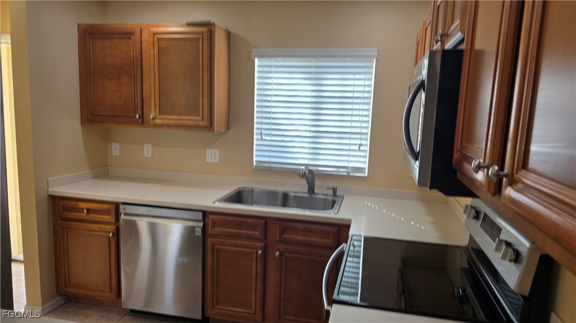 Kitchen featuring stainless steel appliances, ligh
