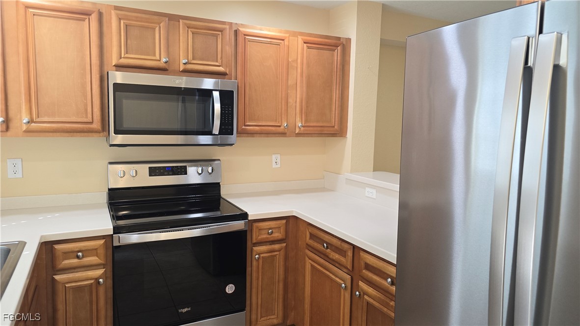 Kitchen with appliances with stainless steel finis