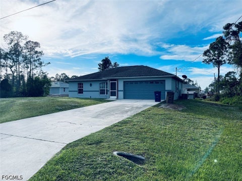 Photo of 5557 Benton Street, Lehigh Acres, FL 33971 (MLS # 2026043046)