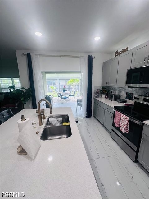 Tiny photo for 317 SW 26th Avenue, Cape Coral, FL 33991 (MLS # 2026020360)