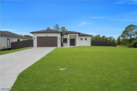 Photo of 710 Almelia Street E, Lehigh Acres, FL 33974 (MLS # 2026041569)