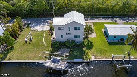 Tiny photo for 16290 Tortuga Street, Bokeelia, FL 33922 (MLS # 2026022656)