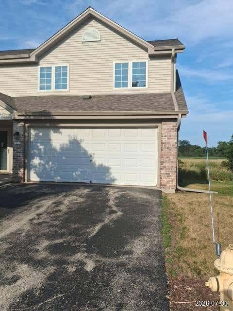 Photo of 1911 Mallard Pointe Cir, Waukesha, WI 53189 (MLS # 1977311)