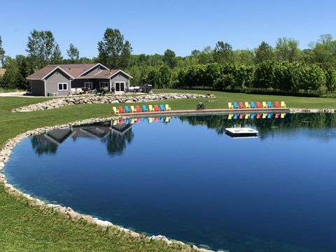 Photo of 985 W Fur Farm Rd, New Holstein, WI 53061 (MLS # 1957402)