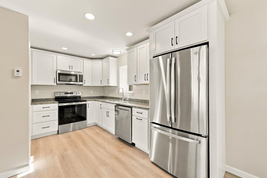 Photo of 166168 Comeau Street, Manchester, NH 03102 (MLS # 5115212)