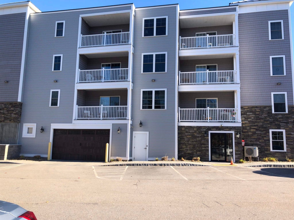 Photo of 19 Kendall Pond Road #205, Derry, NH 03038 (MLS # 5105567)