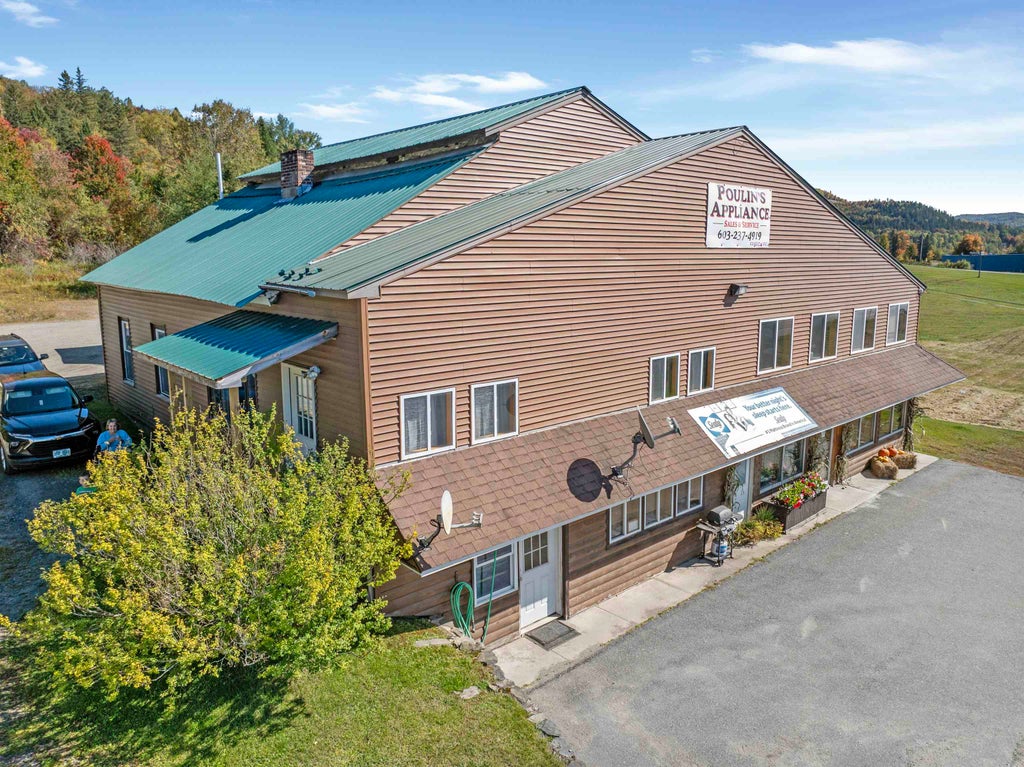 Photo of 102 Trooper Leslie G Lord Memorial Highway, Colebrook, NH 03576 (MLS # 5112644)