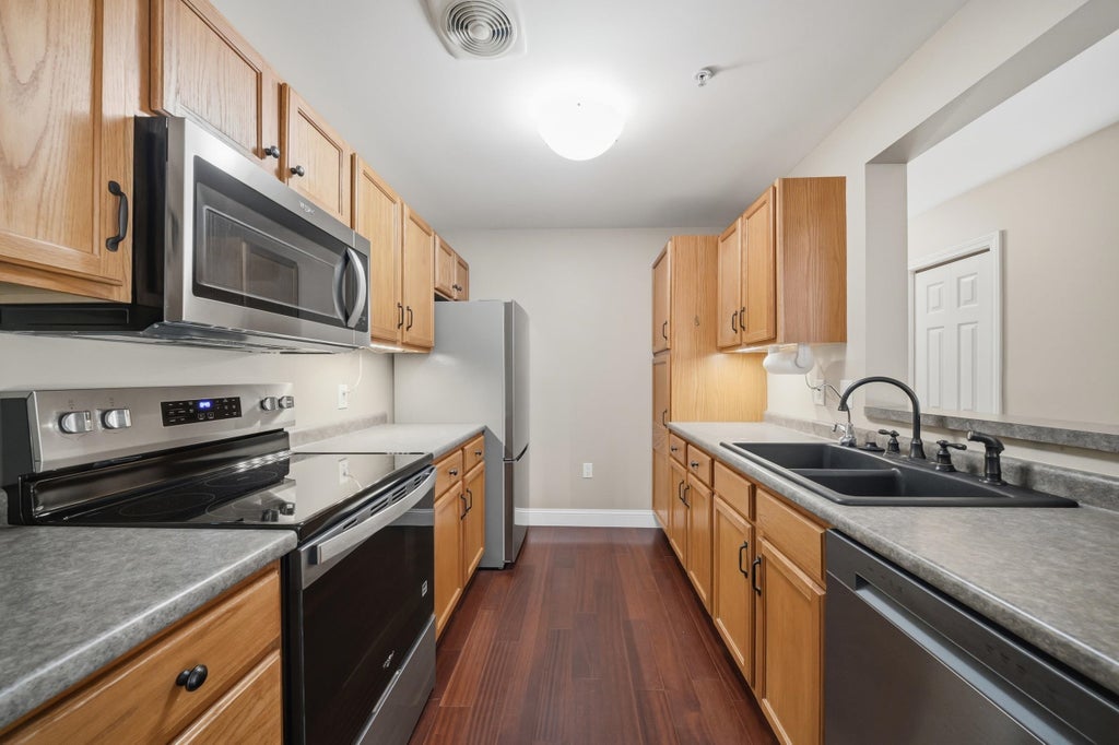 Photo of 245 Edward J. Roy Drive #218, Manchester, NH 03104 (MLS # 5114100)